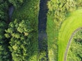 Aerial top view, walking path in a park by a small creek and trees Royalty Free Stock Photo