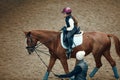 Aerial, top view. Female teacher, instructor teaching little girl, kid horseback riding. Careful ride, outdoor lesson Royalty Free Stock Photo