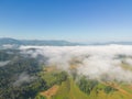 Aerial top view of forest trees and green mountain hills with sea fog, mist and clouds. Nature landscape background, Thailand Royalty Free Stock Photo