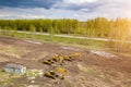 Aerial top view of four yellow crawler excavators standing on ground near the construction site and waiting for the working day to Royalty Free Stock Photo