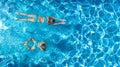 Aerial top view of girls in swimming pool water from above, active children swim, kids have fun on tropical family vacation Royalty Free Stock Photo