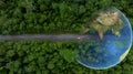 Aerial top view globe planet with electric vehicle car on asphalt road forest in tropical rainforest green forest tree, Green ev Royalty Free Stock Photo