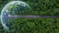 Aerial top view of green electric vehicle car driving over straight forest road, EV car electric vihicle car on forest road with