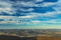 Aerial top view highland hills valley horizon line background landscape scenic view dramatic vivid blue sky cloudscape copy space Royalty Free Stock Photo