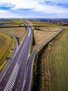 Aerial Top View of highway intersection junction summer morning with car Royalty Free Stock Photo