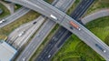 Aerial top view of highway junction interchange road. Drone view of the elevated road, traffic junctions, and green garden. Royalty Free Stock Photo