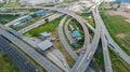 Aerial top view of highway junction interchange road. Drone view of the elevated road, traffic junctions, and green garden. Royalty Free Stock Photo