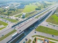 Aerial top view of highway junction interchange road. Drone view of the elevated road, traffic junctions, and green garden. Royalty Free Stock Photo