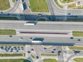 Aerial top view of highway junction interchange road. Drone view of the elevated road, traffic junctions, and green garden. Royalty Free Stock Photo