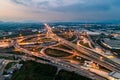 Aerial top view of Highway road junctions. Rush hour traffic on multiple highways in city at night. Transportation and cargo Royalty Free Stock Photo