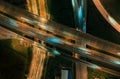 Aerial top view of Highway road junctions. Rush hour traffic on multiple highways in city at night. Royalty Free Stock Photo