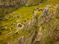 Aerial top view historical Tmogvi fortress ruins with old wall on hilltop and church remains in scenic valley in summer