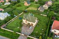 Aerial top view of house shingle roof and a car on paved yard with green grass lawn Royalty Free Stock Photo