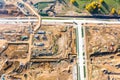 Aerial top view on industrial equipment and machinery working at road construction site Royalty Free Stock Photo