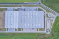 Aerial Top View of Industrial Storage Building Area Many Trucks Unloading Merchandise