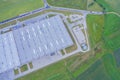 Aerial Top View of Industrial Storage Building Area Many Trucks Unloading Merchandise