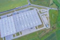 Aerial Top View of Industrial Storage Building Area Many Trucks Unloading Merchandise