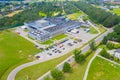 Aerial Top View of Industrial Storage Building Area with Solar Panels on the Roof and Many Trucks Unloading Merchandise Royalty Free Stock Photo