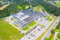 Aerial Top View of Industrial Storage Building Area with Solar Panels on the Roof and Many Trucks Unloading Merchandise Royalty Free Stock Photo