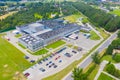 Aerial Top View of Industrial Storage Building Area with Solar Panels on the Roof and Many Trucks Unloading Merchandise Royalty Free Stock Photo