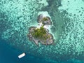 Aerial top view  of  beautiful tropical island with white sand beach and blue clear water and granite stones Royalty Free Stock Photo