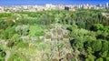 Aerial top view of Kiev city and botanical garden park from above, blossoming lilac and Kyiv cityscape, Ukraine Royalty Free Stock Photo