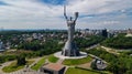 Aerial top view of Kiev Motherland statue monument on hills from above and cityscape, Kyiv, Ukraine