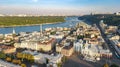Aerial top view of Kyiv cityscape, Dnieper river and Podol historical district skyline, Kontraktova square with ferris wheel