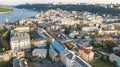 Aerial top view of Kyiv cityscape, Dnieper river and Podol historical district skyline, Kontraktova square with ferris wheel