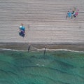 Aerial top view on the La Manga beach. Umbrellas, traces on the sand and turquoise mediterranean sea