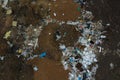 Aerial top view of a large pile of garbage. Pile of garbage on an illegal elemental garbage dump or on landfill, Many household