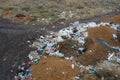 Aerial top view of a large pile of garbage. Pile of garbage on an illegal elemental garbage dump or on landfill, Many household