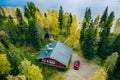 Aerial top view of log cabin or cottage with sauna in spring forest by the lake in Finland Royalty Free Stock Photo