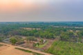 Aerial top view of lush green trees and river or lake from above in tropical forest in national park and mountain or hill in Royalty Free Stock Photo