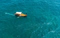 Aerial top view of luzzu - traditional wooden colorful fishing boat in Valletta Grand Harbor, Malta, with turquoise sea Royalty Free Stock Photo