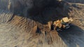 Aerial top view of the machines at work at the construction site. Scene. Bulldozer and truck working with sand. Royalty Free Stock Photo