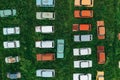 Aerial top view of many old retro rusty abandoned cars in green field, cemetery of vintage cars Royalty Free Stock Photo