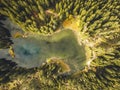 Aerial top view of misty forest trees in forest in Slovakia. Drone photography. Lake in the mountains. Royalty Free Stock Photo