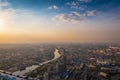 Aerial top view of Moscow city panorama at sunset, river and bridges, roads and buildings in evening myst