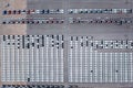 Aerial top view new cars lined up parked in a row in warehouse at the commercail dock for exporting to distributors and dealers