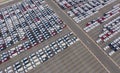 Aerial top view of new cars parking for sale stock lot row, dealer inventory import and export business commercial worldwide, Royalty Free Stock Photo