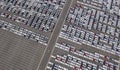 Aerial top view of new cars parking for sale stock lot row, dealer inventory import and export business commercial worldwide, Royalty Free Stock Photo