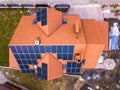 Aerial top view of new modern residential house cottage with blue shiny solar photo voltaic panels system on roof. Renewable Royalty Free Stock Photo