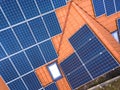 Aerial top view of new modern residential house cottage with blue shiny solar photo voltaic panels system on roof. Renewable Royalty Free Stock Photo