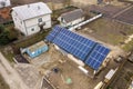 Aerial top view of new modern residential house cottage with blue shiny solar photo voltaic panels system on roof. Renewable Royalty Free Stock Photo