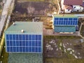 Aerial top view of new modern residential house cottage with blue shiny solar photo voltaic panels system on roof. Renewable Royalty Free Stock Photo