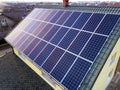 Aerial top view of new modern residential house cottage with blue shiny solar photo voltaic panels system on roof. Renewable Royalty Free Stock Photo