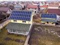 Aerial top view of new modern residential house cottage with blue shiny solar photo voltaic panels system on roof. Renewable Royalty Free Stock Photo