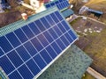 Aerial top view of new modern residential house cottage with blue shiny solar photo voltaic panels system on roof. Renewable Royalty Free Stock Photo