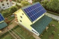 Aerial top view of new modern residential house cottage with blue shiny solar photo voltaic panels system on roof. Renewable Royalty Free Stock Photo